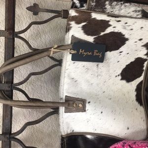 Cowhide and leather hand bag